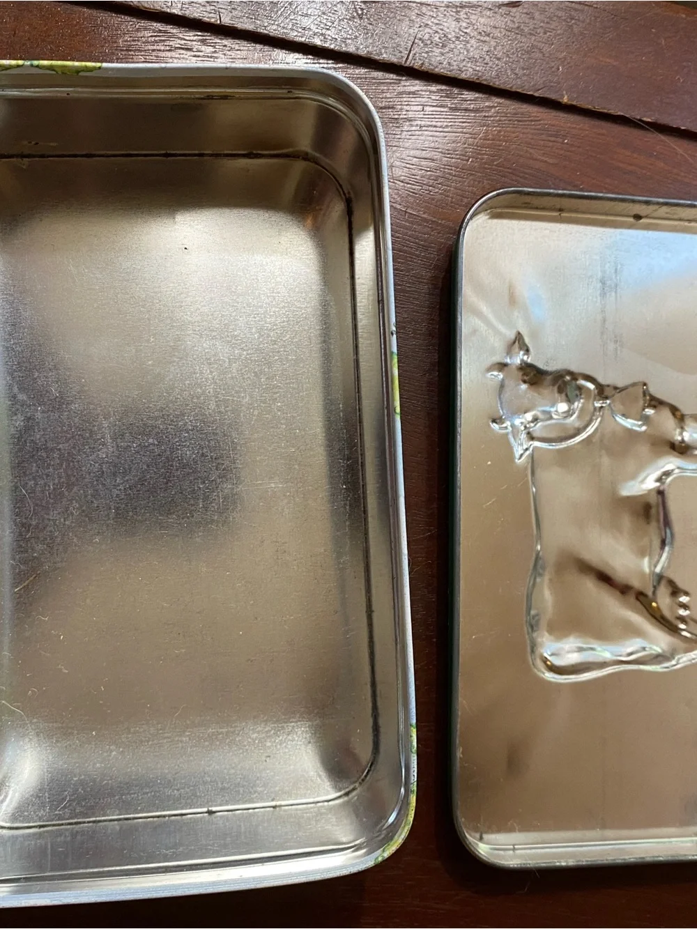 Two vintage tin containers
